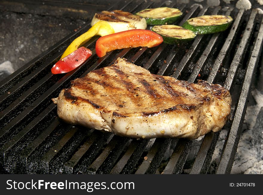 Steaks cooked on a grill in the restaurant