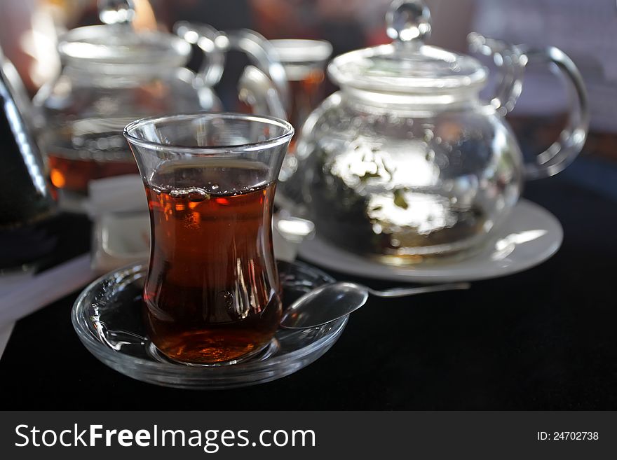 Turkish Traditional Tea in glass at restaurant. Turkish Traditional Tea in glass at restaurant.