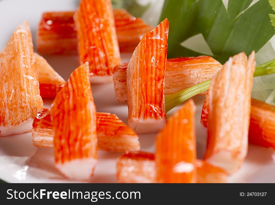 Decorate crab stick in white plate Japanese food.