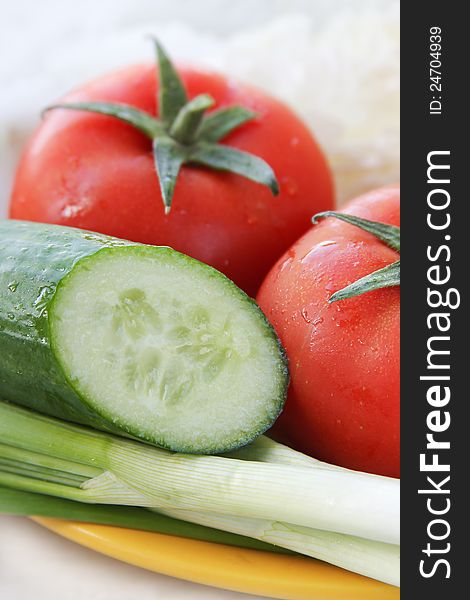 Salad ingredients with tomato, onion and cucumber