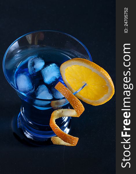 Blue cocktail on black background