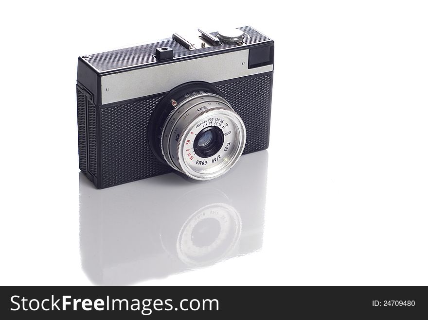 Old photo camera on white background