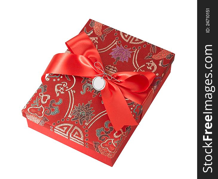 A beautiful fabric gift box with red ribbon