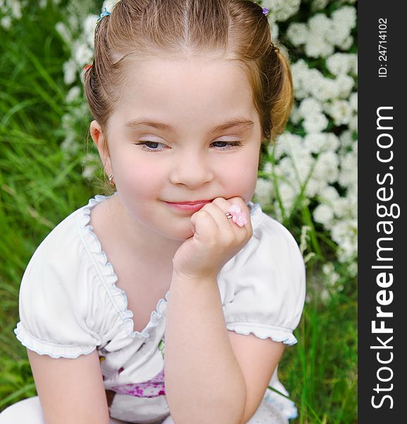 Portrait Of Thinking Little Girl Outdoor