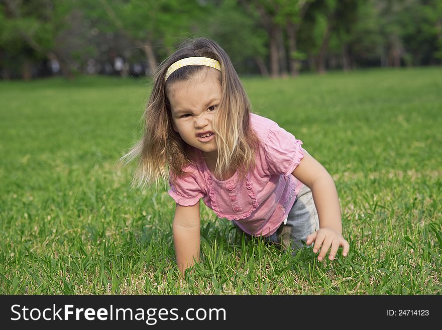 A girl shows a wild animal in the park