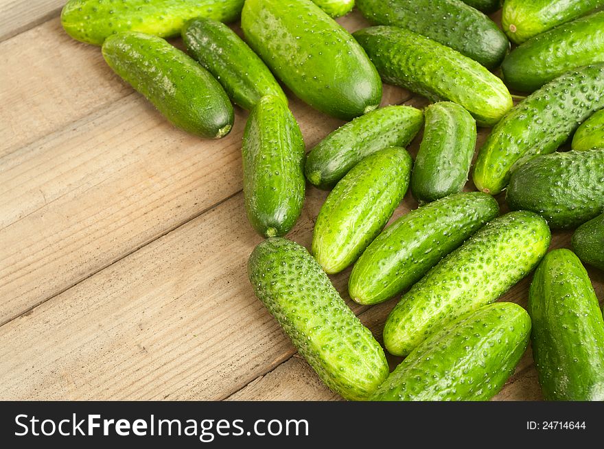 Fresh cucumbers on wooden table