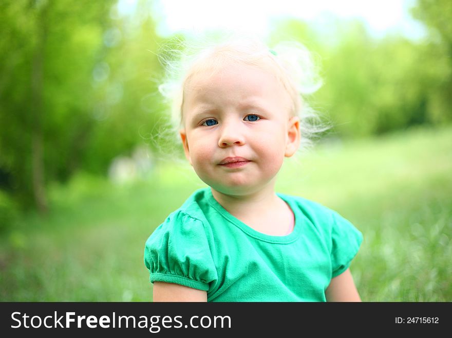 Portrait of a child against the nature of