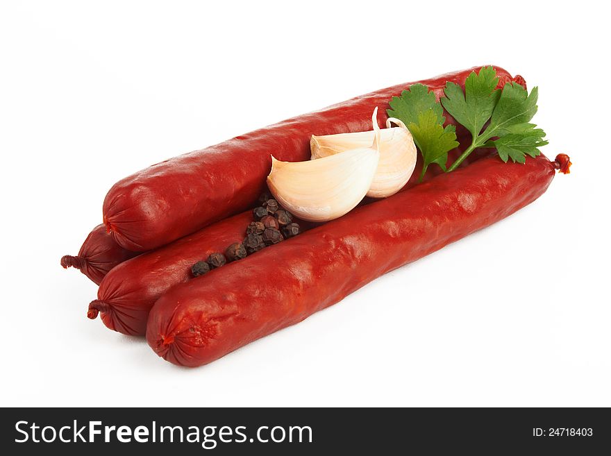 Raw red sausage on a white background