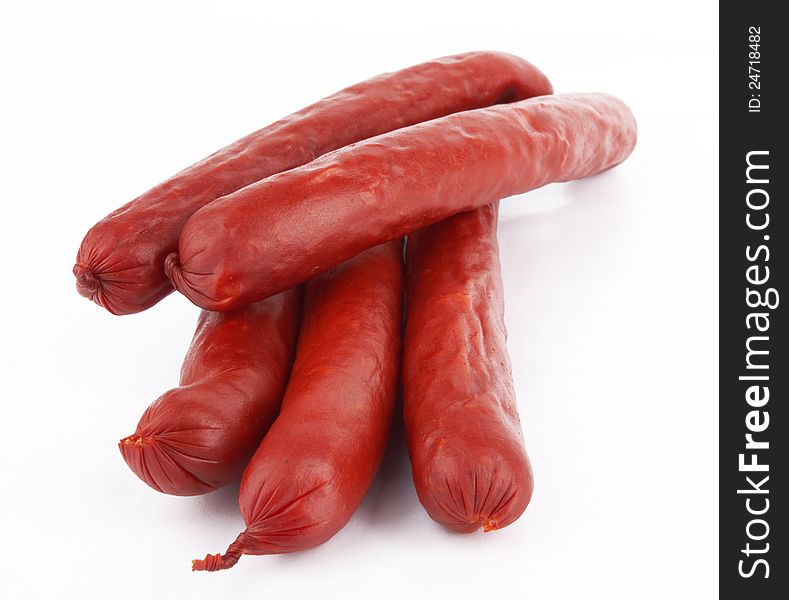 Raw red sausage on a white background