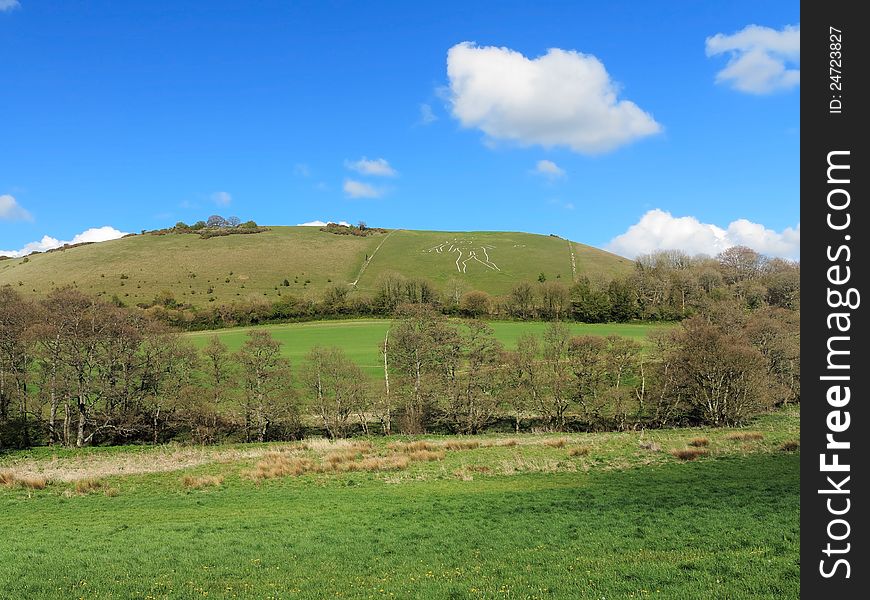 A Rural Landscape in Dorset, England with the Cerne Abbas Giant carved into the hillside. A Rural Landscape in Dorset, England with the Cerne Abbas Giant carved into the hillside