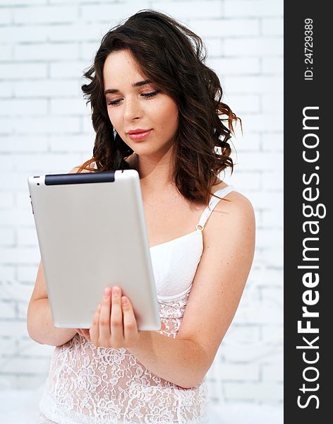 Beautiful Young Woman Using Tablet Computer
