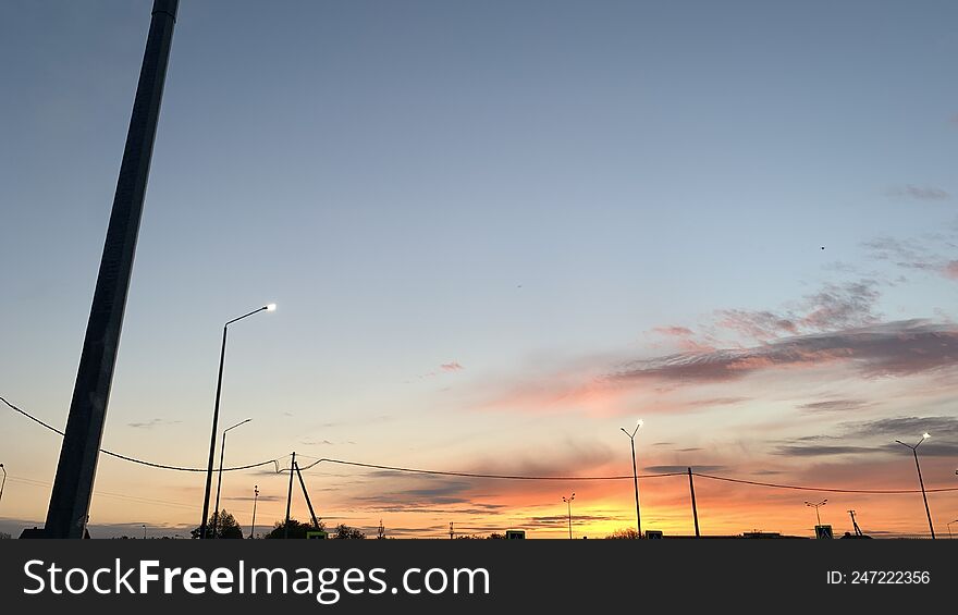 Evening Sunset, The Sky Was Painted In Bright Colors When The Sun Went Down Below The Horizon.