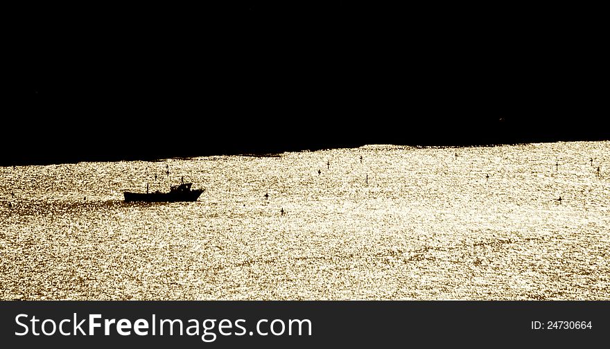 Fishermen's boat at dusk in Sorrento bay. Fishermen's boat at dusk in Sorrento bay