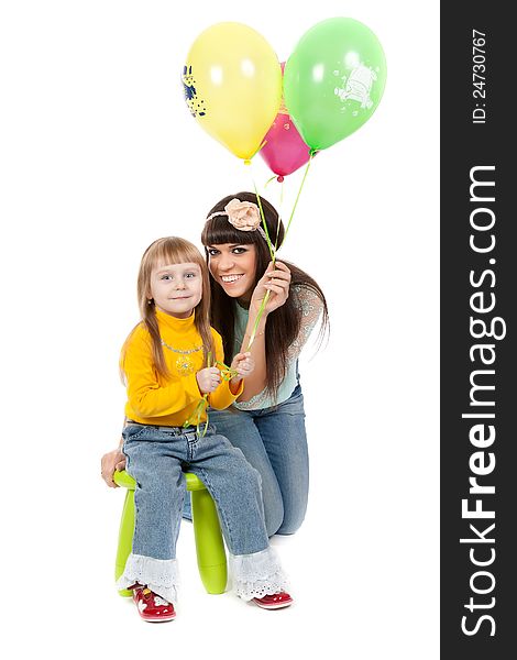 Mother and his daughters with colorful balloons. studio shoot over white background. Mother and his daughters with colorful balloons. studio shoot over white background