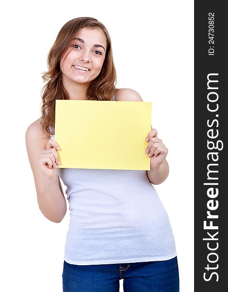 Young girl shows empty sheet of a yellow paper. Isolation on the white. Young girl shows empty sheet of a yellow paper. Isolation on the white