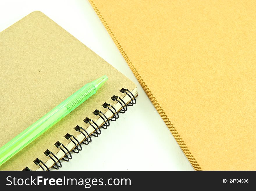 Notebook and envelope on white background