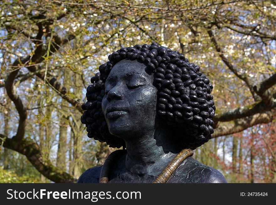 Bronze of a Afro-american head sculpture. Bronze of a Afro-american head sculpture.