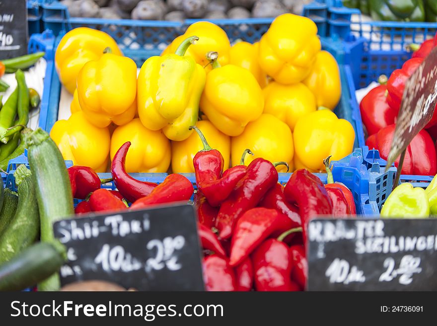 A variety of fresh vegetables on a market stall. A variety of fresh vegetables on a market stall.