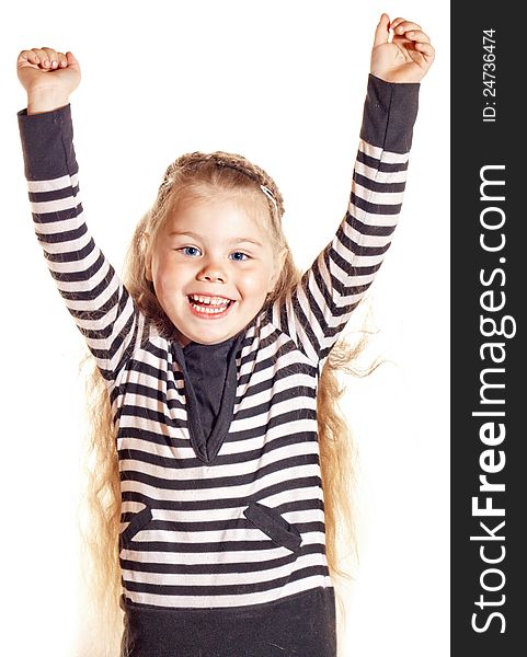 Funny smiling little girl with blue eyes, raises her hands up