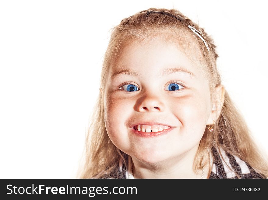 Funny smiling little girl with blue eyes