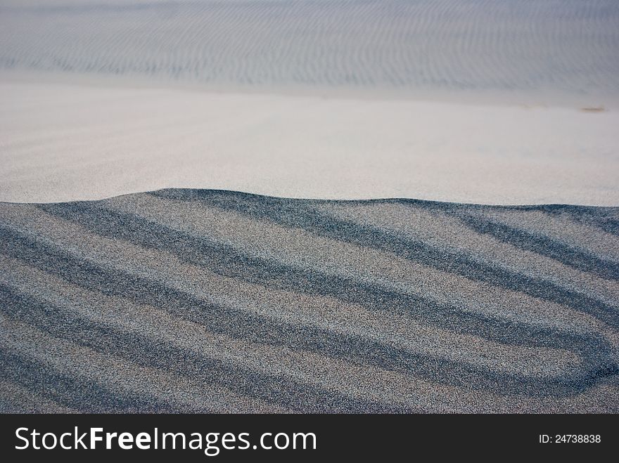 Layers of different colored sand in desert dunes. Layers of different colored sand in desert dunes