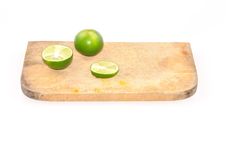Limes Slice On Wooden Block Isolated On White Stock Image