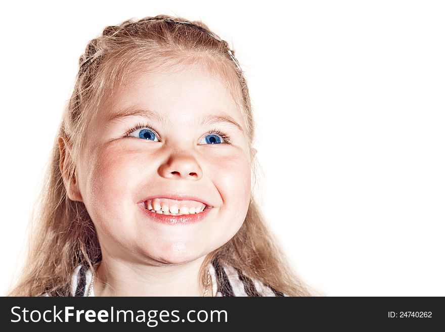 Funny smiling little girl with blue eyes