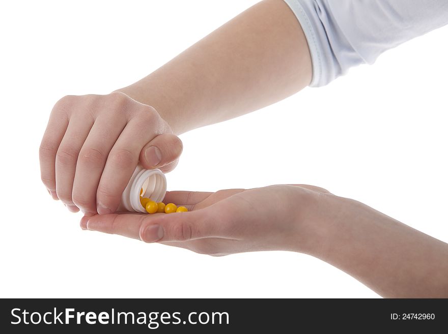 Image of a hands holding vitamins on white