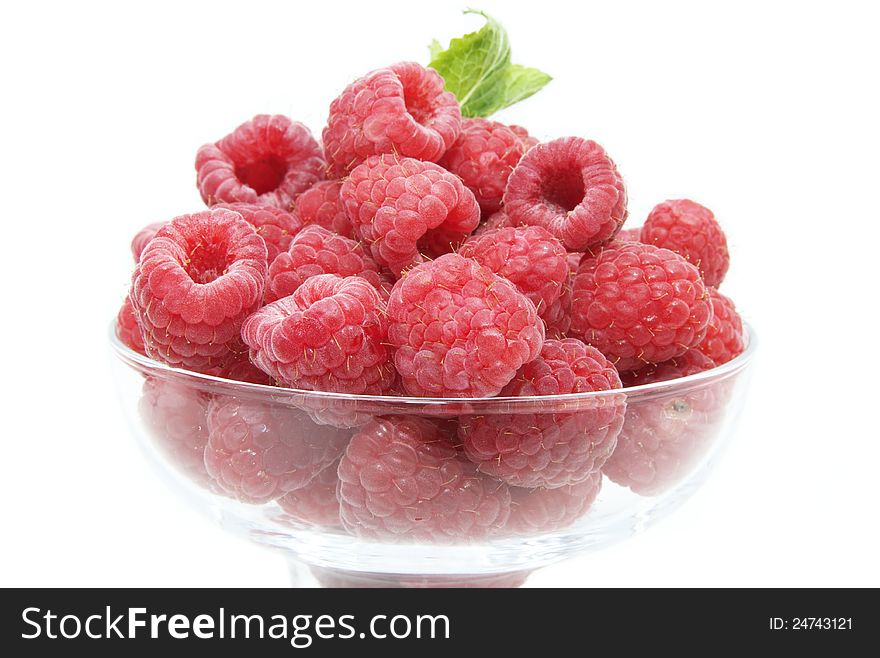 Raspberry on white background in the restaurant. Raspberry on white background in the restaurant