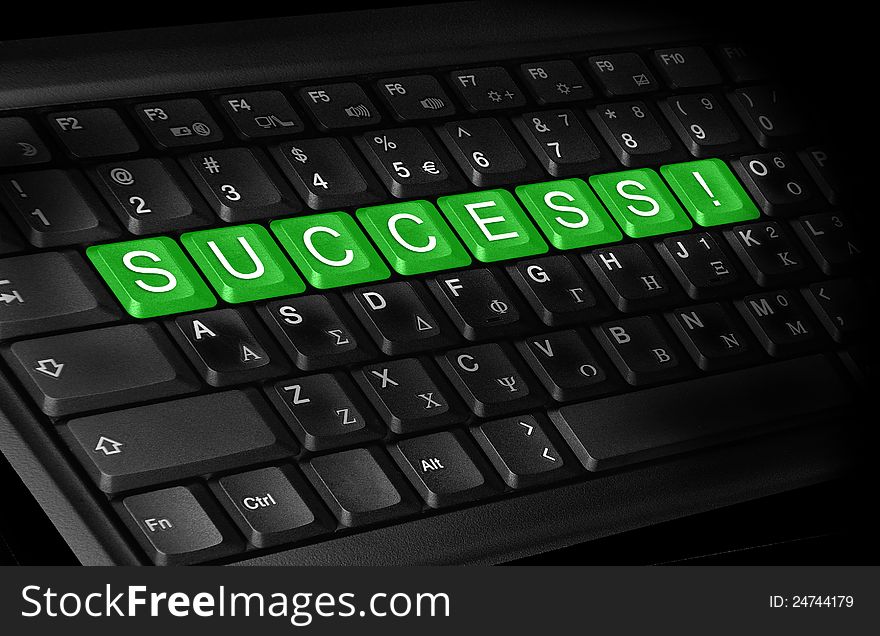 Laptop keyboard and text ''Success'' colored green.