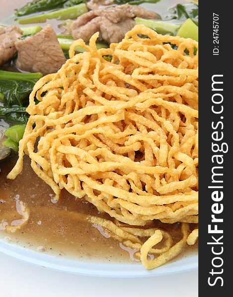 Crispy yellow noodle with in a creamy gravy sauce