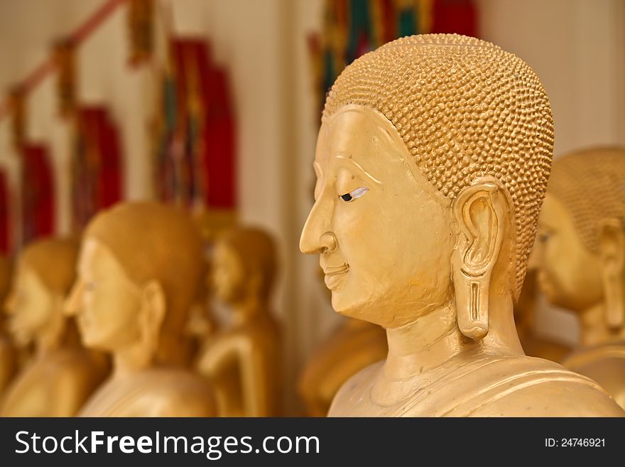 The golden face of buddha in the temple