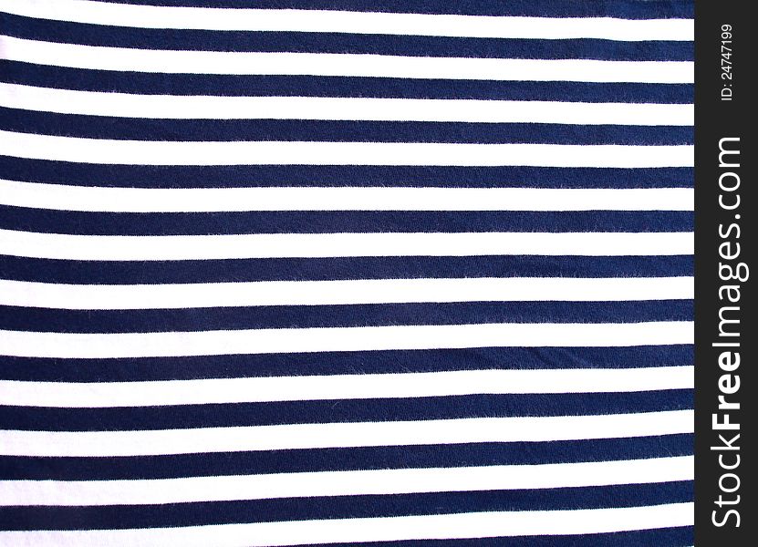 Detail of blue and white sailor's shirt before packing into a suitcase. Detail of blue and white sailor's shirt before packing into a suitcase.