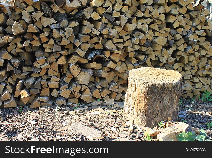 A lot of firewood against the blue sky