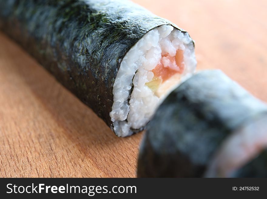 Delicious sushi with salmon, avocado and shrimp. Delicious sushi with salmon, avocado and shrimp