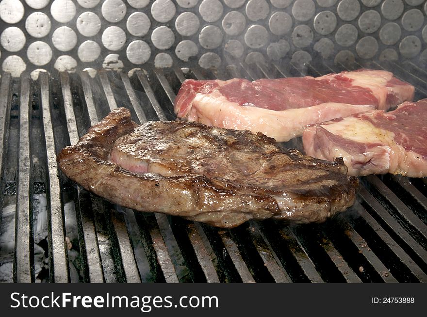 Steak cooked on a grill in the restaurant. Steak cooked on a grill in the restaurant