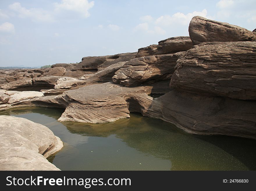 The traces of the river eroded the rock into a beautiful trail along the banks of the Mekong River between Thailand and Laos. The traces of the river eroded the rock into a beautiful trail along the banks of the Mekong River between Thailand and Laos.