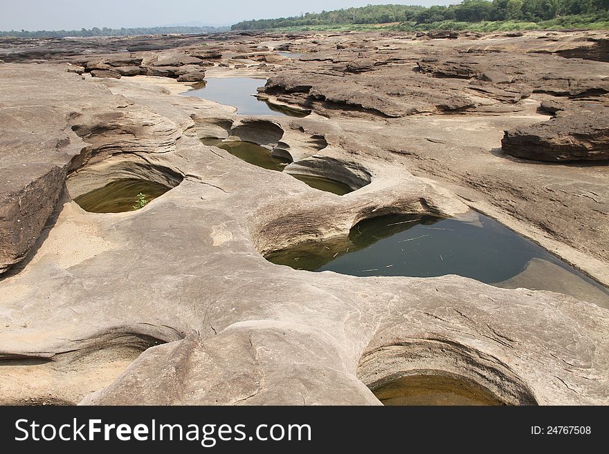 The traces of the river eroded the rock into a beautiful trail along the banks of the Mekong River between Thailand and Laos. The traces of the river eroded the rock into a beautiful trail along the banks of the Mekong River between Thailand and Laos.