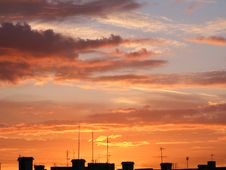 Orange Clouds Over A House Top Royalty Free Stock Photography Orange Clouds Over A House Top Royalty Free Stock Photography