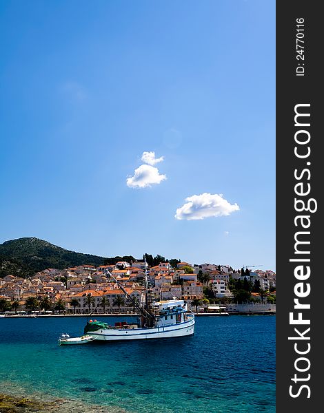 Boat on perfect blue waters. Boat on perfect blue waters