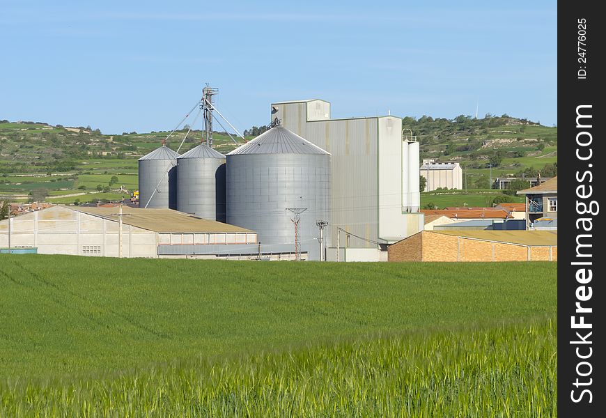 Agricultural farm with silos where wheat is stored in. Agricultural farm with silos where wheat is stored in