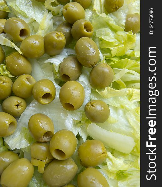 Fresh green salad with green olives pitted