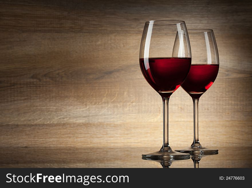 Two Wine glases on a wooden Background