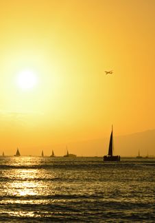 Sailboats And Airplane Over Hawaiian Sunset Royalty Free Stock Images Sailboats And Airplane Over Hawaiian Sunset Royalty Free Stock Images