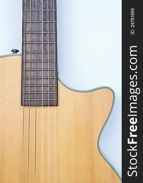 Detail from acoustic guitar isolated on a white background