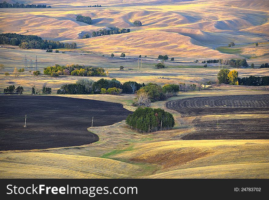 The Autumn landscape with fallow-field in golden colours. The Autumn landscape with fallow-field in golden colours.