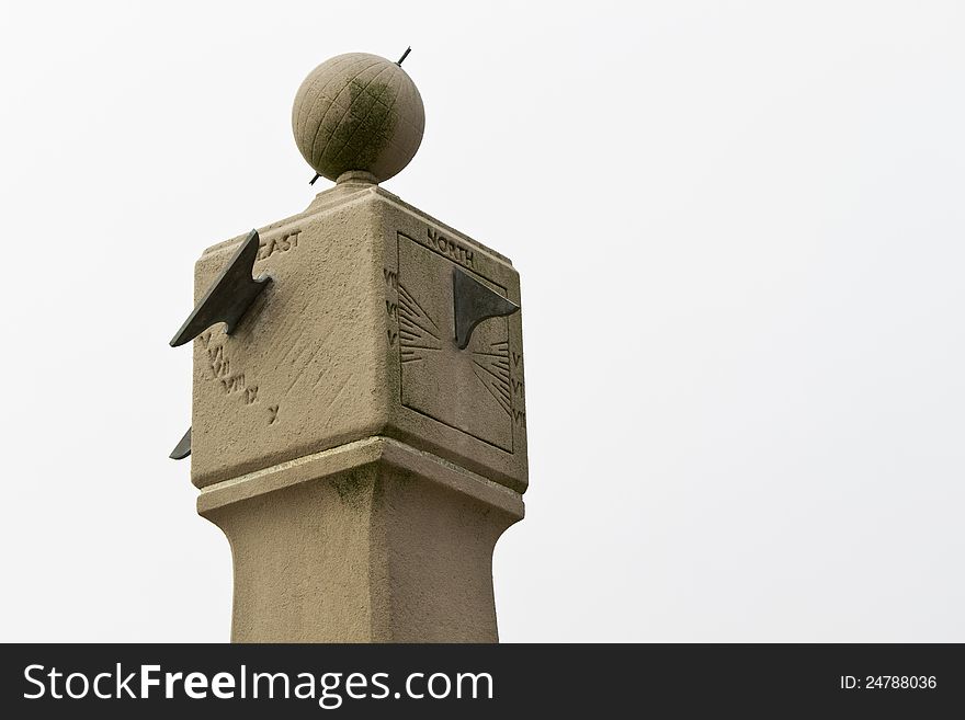 Old, mossy and worn, stone sun dial, a weatherworn symbol of time, weather, and travel; location is the state of Massachusetts, USA;. Old, mossy and worn, stone sun dial, a weatherworn symbol of time, weather, and travel; location is the state of Massachusetts, USA;