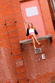 Pretty Teenage Girl Sitting On A Ledge Stock Photo Pretty Teenage Girl Sitting On A Ledge Stock Photo