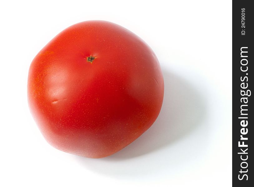 A close up shot of a tomato isolated on the white background