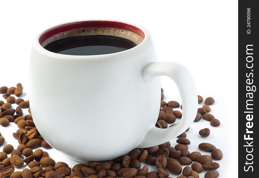 A close up shot of a white cup filled with coffee. A close up shot of a white cup filled with coffee